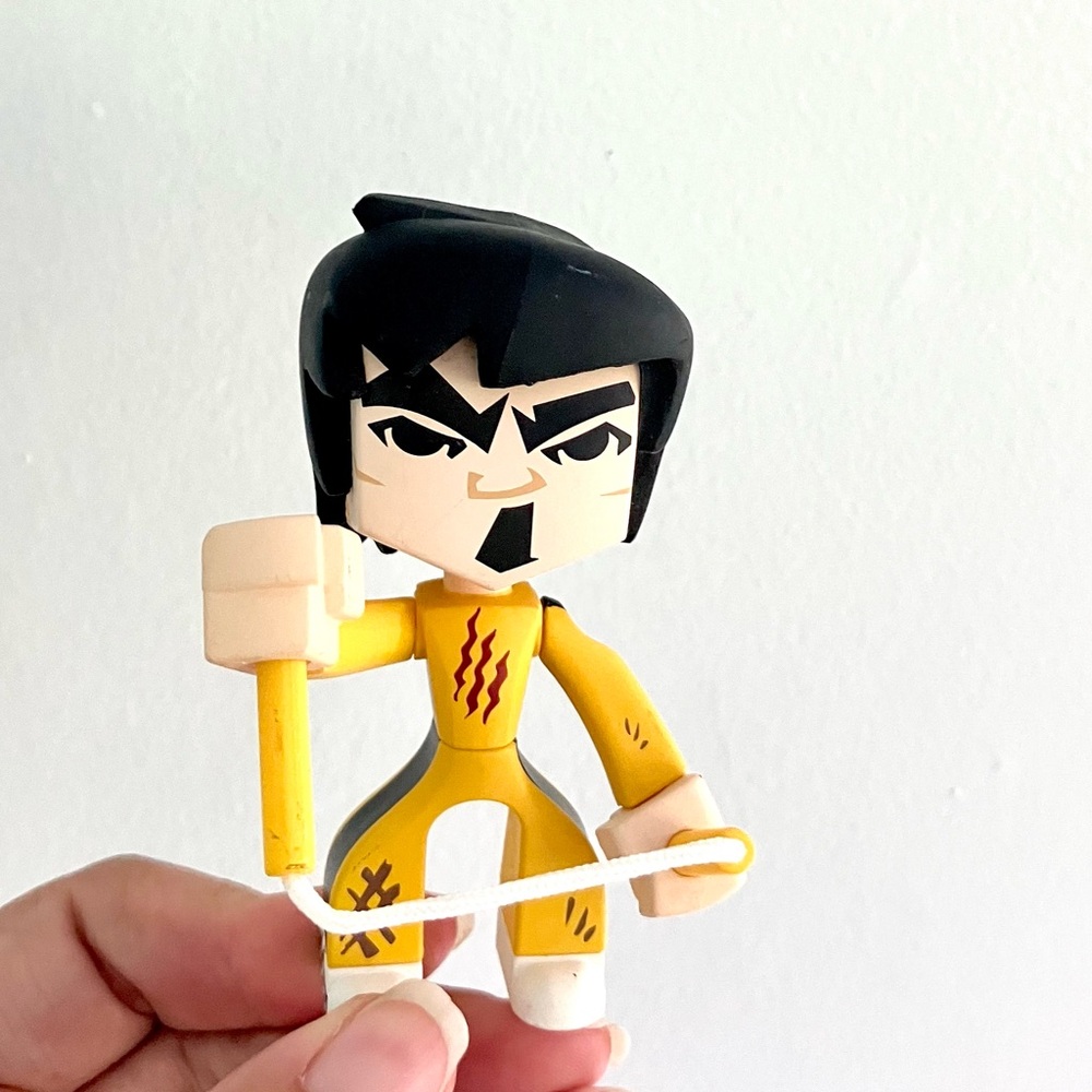 Kidrobot Bruce Lee with nunchucks figure